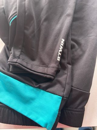 Pantalone da spinning nero con banda turchese