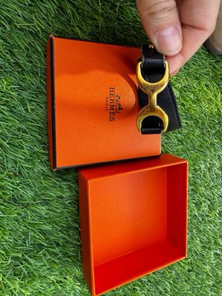 Pulsera Hermes Negra y Dorada