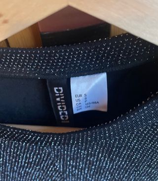 Jersey brillante negro y plateado