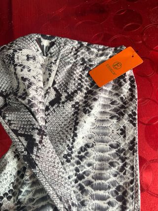 Pantalón campana estampado serpiente mujer