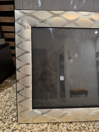 Portaretrato de plata con diseño