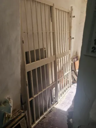 Puerta reja doble hoja maciza