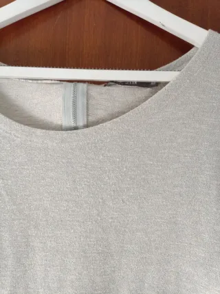 Blusa plateada brillante