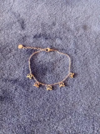 Pulsera de acero con adornos, Indalo