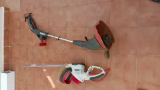 Cortasetos eléctrico y desbrozadora