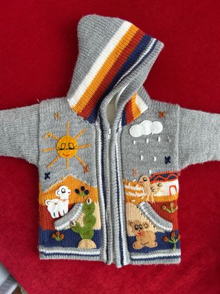 Golfino peruviano bimbo con cappuccio