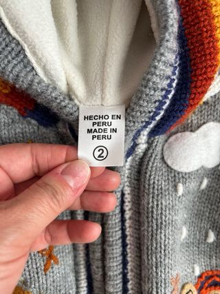 Golfino peruviano bimbo con cappuccio