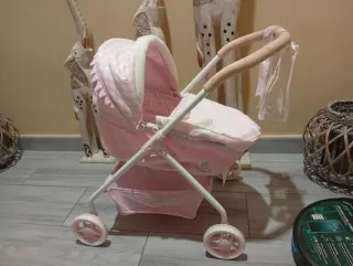 Carro de muñecas rosa