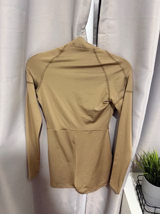 Mono beige con cremallera