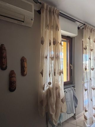 Tende beige con rombi marroni