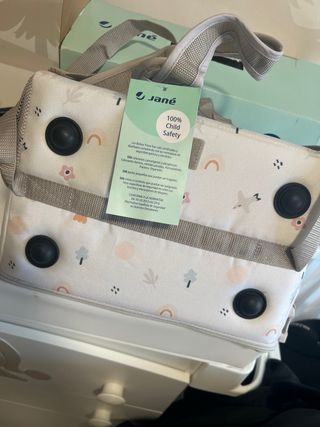 Trona portátil Jané convertible en bolso