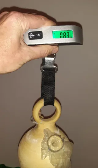 OF Peso balanza portatil viaje Pesa 50 Kg. En mano