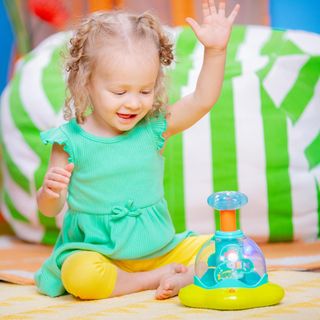 Bright Starts, Juguete Muiscal Press & Glow Spinne