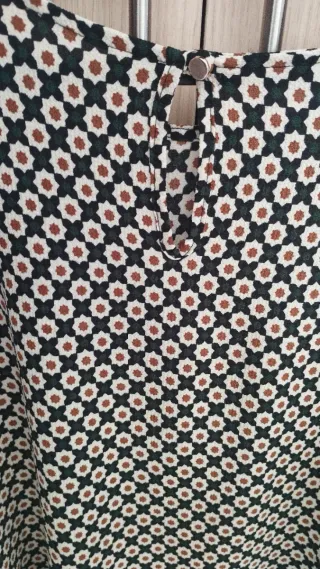 Blusón estampado con mangas acampanadas