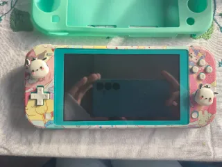 Nintendo Switch Lite + 3 juegos + accesorios