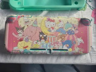 Nintendo Switch Lite + 3 juegos + accesorios