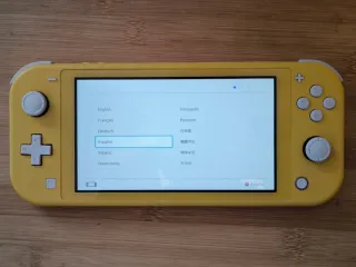 Nintendo Switch Lite + Caja + Cargador + Funda