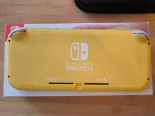 Nintendo Switch Lite + Caja + Cargador + Funda