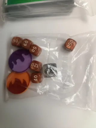 Energías, dados y monedas Pokémon