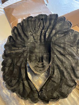 Pannello decorativo dorato volto a forma di sole