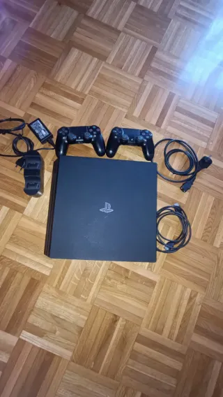 PS4 Pro (limpia) 1 TB + 2 mandos + juegos