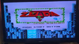 Nintendo NES más mandos y cartucho 509 juegos.