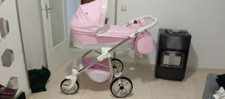 Carro de bebé rosa casi nuevo