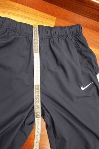 Pantalón Nike Azul Marino con Raya Blanca