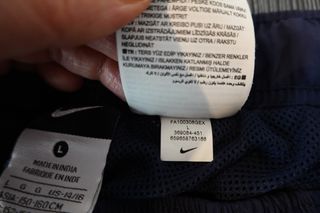 Pantalón Nike Azul Marino con Raya Blanca