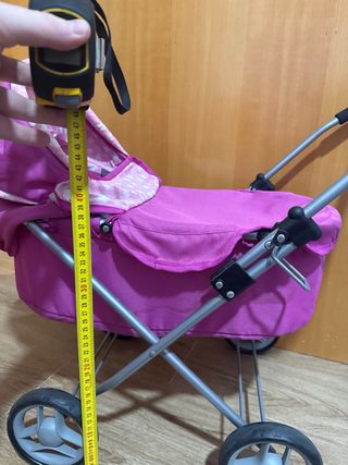 Carro de muñecas rosa