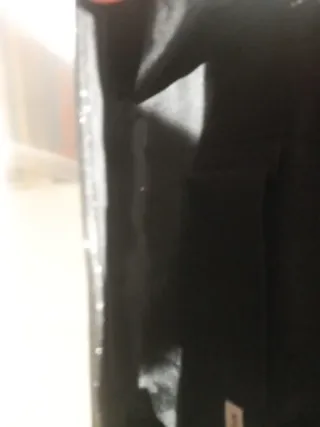 Bolso de fiesta negro con cadena dorada