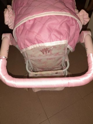 Carrito gemelar rosa con capota