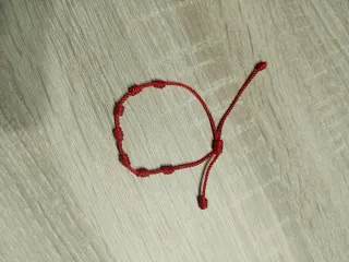 Pulsera 7 nudos roja