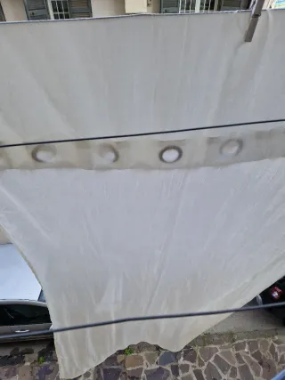 Coppia tende bianche con anelli