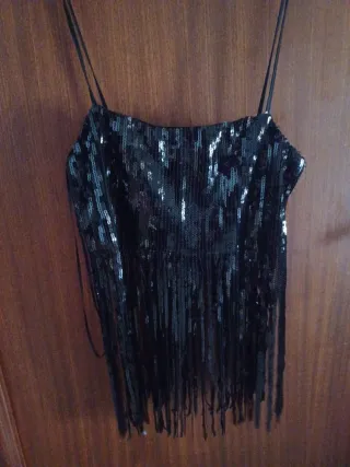 Top lentejuelas con flecos