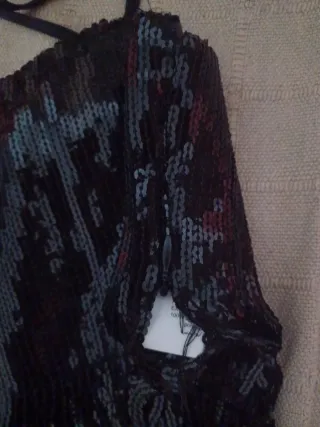 Top lentejuelas con flecos