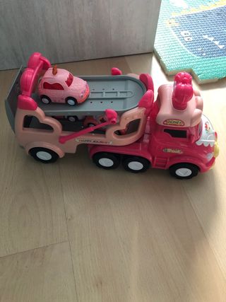 Camión de juguete rosa con música