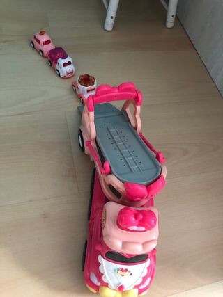 Camión de juguete rosa con música