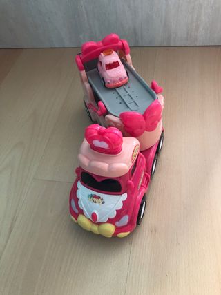 Camión de juguete rosa con música
