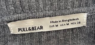 Jersey de punto gris cuello alto