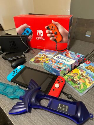 Nintendo Switch completa + 4 juegos + accesorio