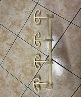 Appendiabiti da parete beige in ferro battuto