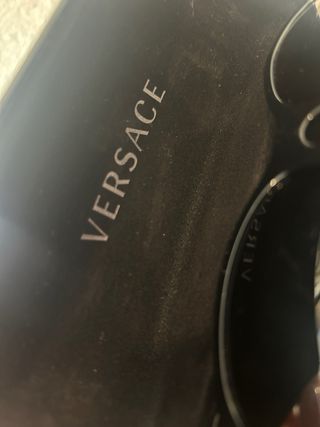 Gafas de sol Versace negras y doradas