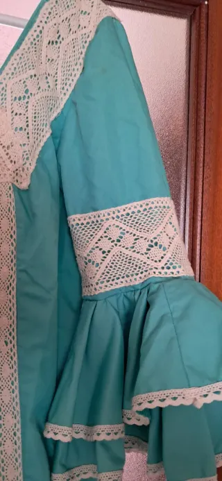 Traje de flamenca verde con volantes