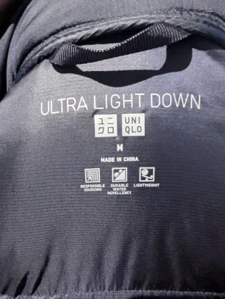 Abrigo plumífero negro 3/4