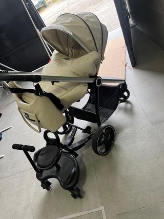 Carro de bebé color crema