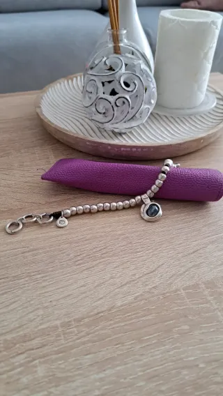 Pulsera Ciclón Plata y Piedra oscura.