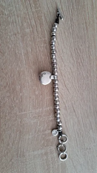 Pulsera Ciclón Plata y Piedra oscura.