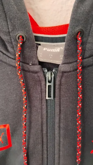 Sudadera Max Verstappen Puma azul y naranja.