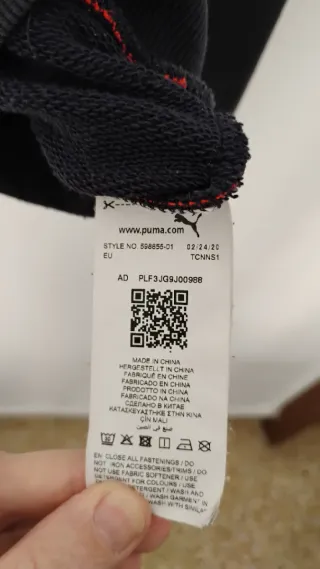 Sudadera Max Verstappen Puma azul y naranja.